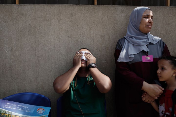 A man cries after seeing the body of a family member at the Liltaqmeen al-Sahy Hospital in Cairo's Nasr City district, after a shooting at the site of a pro-Morsi sit-in in front of the headquarters of the Egyptian Republican Guard, on July 8, 2013.