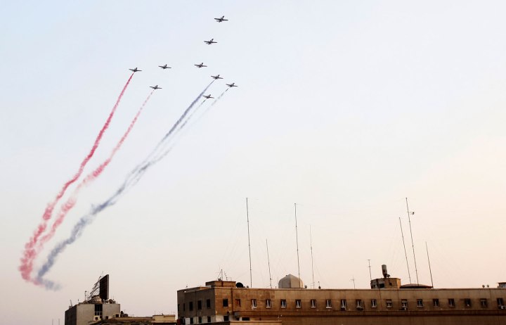 Egyptian military jets fly in formation over Tahrir square in Cairo