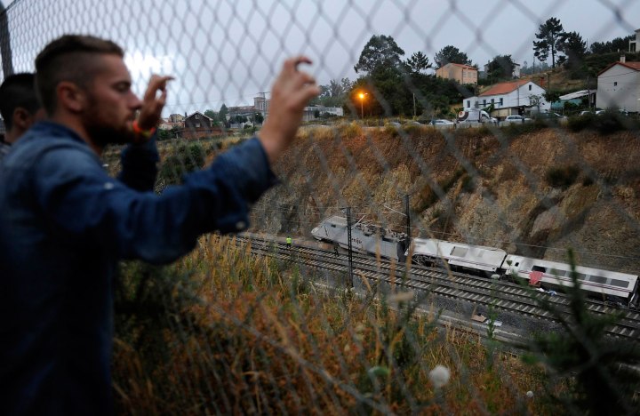 Onlookers view wreckage of train crash near Santiago de Compostela