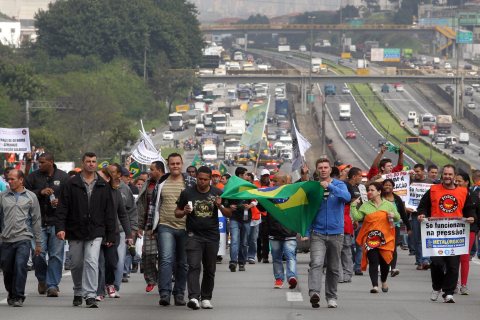 Protesters block stretch of highway in southeastern Brazil, on July 11, 2013.
