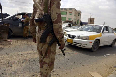 Yemeni soldiers search vehicles at a checkpoint on a street leading to the U.S. embassy compound as authorities tighten security measures in Sanaía, Yemen, on Aug. 6, 2013.