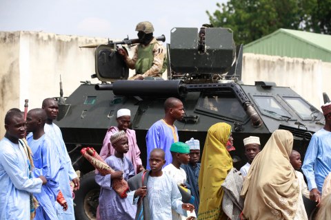 Nigerian soldiers in an armored personal carrier during Eid al-Fitr prayers at Ramat square in Maiduguri, Nigeria, on Aug. 8, 2013.