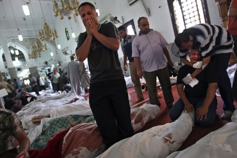 Egyptians mourn in the El-Iman mosque at Nasr City, Cairo, Aug. 15, 2013.