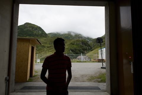 An asylum seeker at the entrance of a military bunker in the remote Alpine village of Realp, central Switzerland, on Aug. 9, 2013.