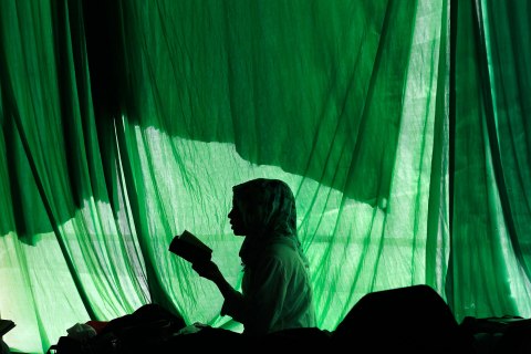 A student reads the Koran in a mosque in Jakarta
