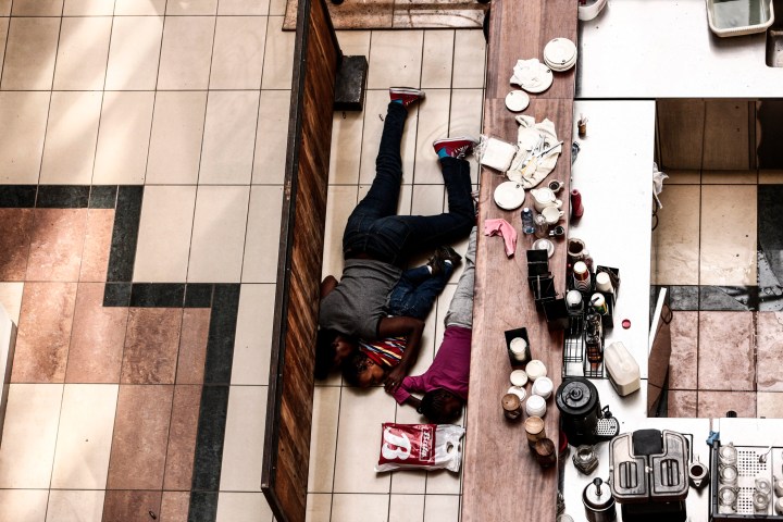 People take cover behind a counter at the Westgate shopping mall after a shootout in Nairobi, Kenya, Sept. 21, 2013.