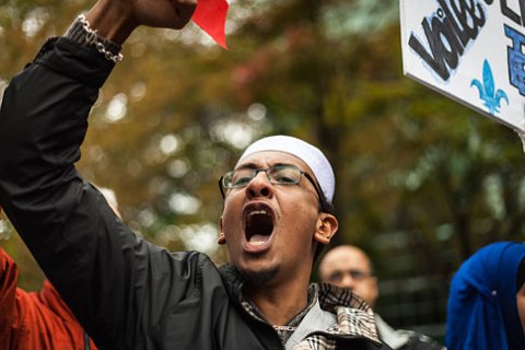 A man shouts as he joins a protest against a proposed Charter of Values that will see the banning of the wearing of overtly religious clothing or items by those working in the public sector, in Montreal, on Sept. 14, 2013.