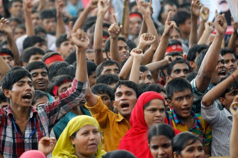 Garment workers shout slogans during a rally demanding an increase to their minimum wage in Dhaka