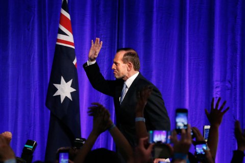 Australia's conservative leader Tony Abbott  gestures as he walks to the stage to claim victory in Australia's federal election during an election night function in Sydney Sept. 7, 2013. 