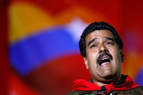 Venezuela's presidential candidate Nicolas Maduro sings during a campaign rally in Caracas