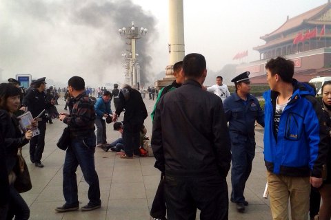 Smoke rises in front of the main entrance of the Forbidden City at Tiananmen Square in Beijing on Oct. 28, 2013.