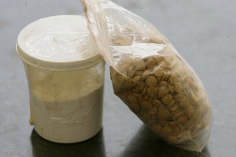 Captagon pills are displayed along with a cup of cocaine at an office of the Lebanese Internal Security Forces