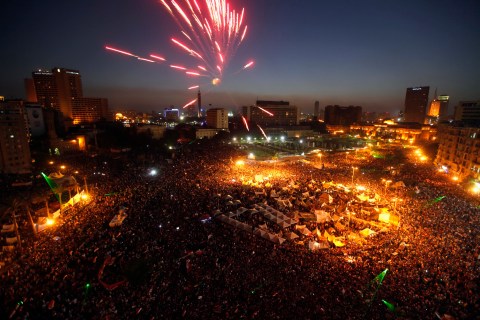 Protesters opposing Egyptian President Mohamed Mursi set off fireworks during a protest at Tahrir Square in Cairo