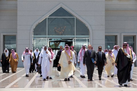 Saudi Arabia's Foreign Minister Prince al-Faisal walks toward the plane carrying U.S. Secretary of State John Kerry upon his arrival in Jeddah