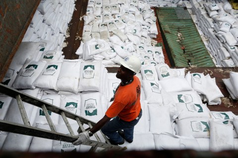 worker stands next to bags labeled "Cuban Raw Sugar" are seen inside a North Korean flagged ship "Chong Chon Gang" docked at the Manzanillo Container Terminal in Colon City