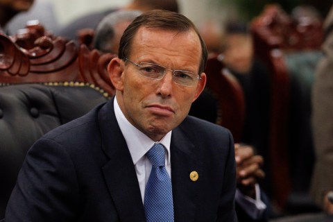 Australia's PM Abbott attends a session of the CHOGM in Colombo