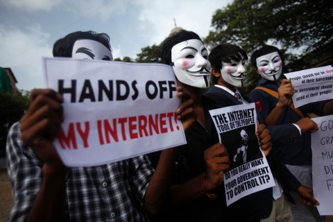 Protesters from the Anonymous India group of hackers wear Guy Fawkes masks as they protest against laws they say gives the government control over censorship of internet usage in Mumbai
