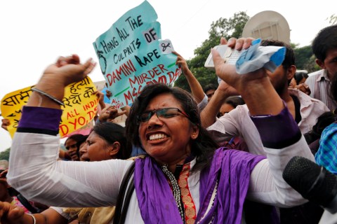 A demonstrator shouts slogans outside a court in New Delhi