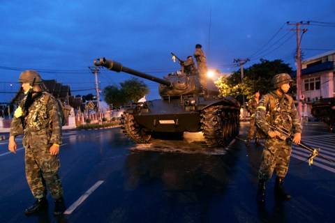 A tank stands outside the Government House in Bangkok