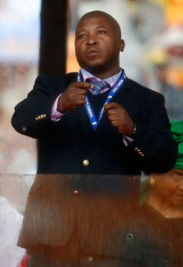 A man passing himself off as a sign language interpreter punches the air during a speech being given by India's President Pranab Mukherjee at a memorial service for late South African President Nelson Mandela at the FNB soccer stadium in Johannesburg. December 10, 2013.