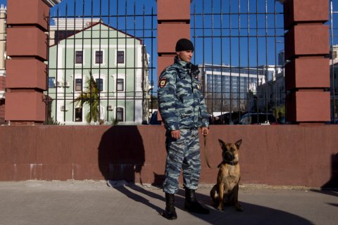 A Russian police officer stands on a street in Sochi, December 30, 2013.