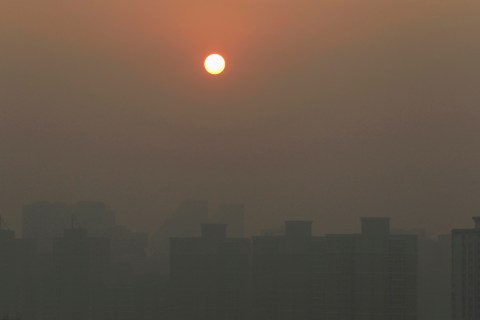 Apartment blocks are pictured amid the heavy haze in Beijing