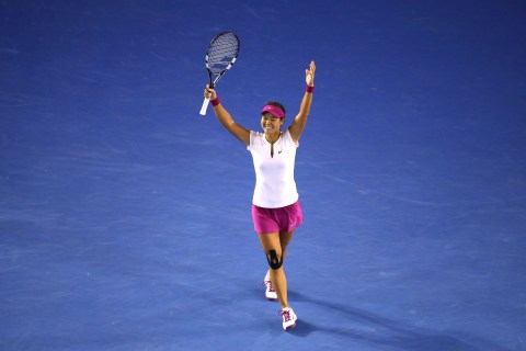 Li Na of China celebrates winning the 2014 Australian Open at Melbourne Park on January 25, 2014 in Melbourne.