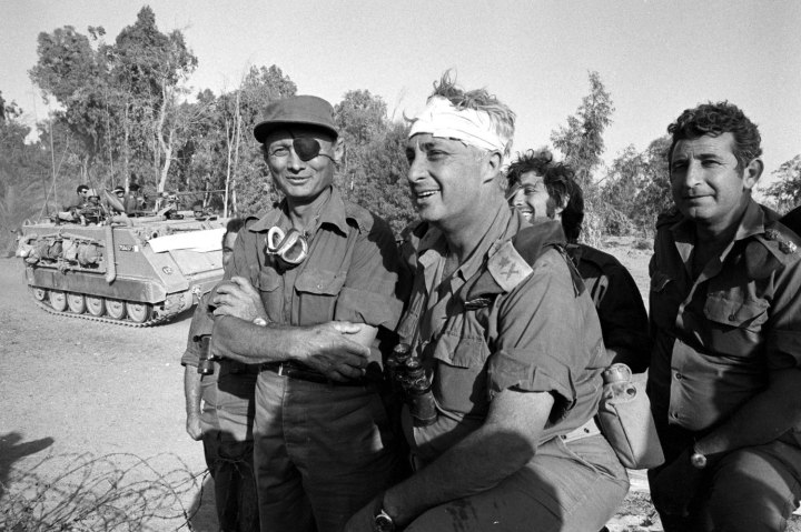 Israeli army Southern Command General Ariel Sharon with Defense Minister Moshe Dayan during the Yom Kippur War in October 1973 on the western bank of the Suez Canal in Egypt.