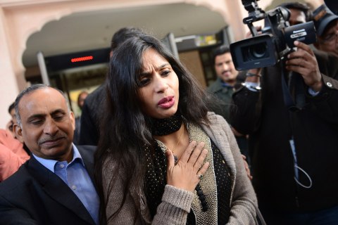 Indian diplomat Khobragade leaves with her father to meet India's Foreign Minister Salman Khurshid in New Delhi