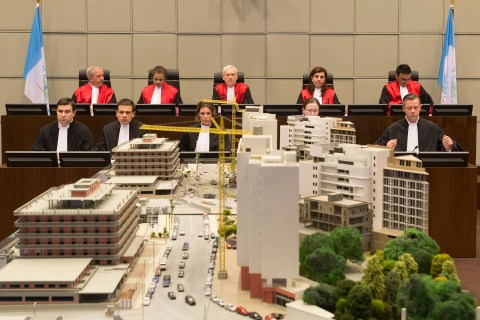 From left: Judges Walid Akoum, Janet Nosworthy, David Re, Micheline Braidy and Nicola Lettier preside over the first hearing in the in absentia trial of four people accused of murdering former Lebanese premier Rafiq Hariri at the Special Tribunal for Lebanon in The Hague on Jan.16, 2014.