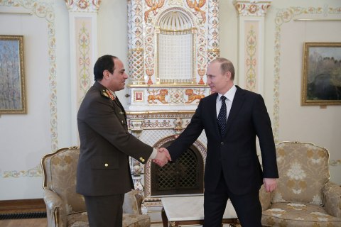 From right: Russia's President Vladimir Putin shakes hands with Egyptian Defense Minister Abdel Fattah al-Sisi during a meeting at the Novo-Ogaryovo state residence outside Moscow, on Feb. 13, 2014.