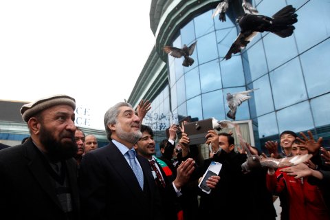 Supporters of Afghan presidential candidate Abdullah Abdullah release pigeons during the first day of the presidential election campaign in Kabul