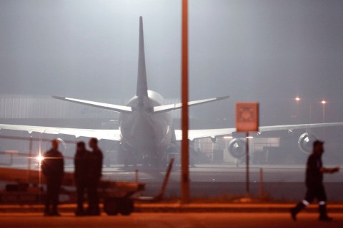 Turkish police forces arrive at the scene after hijacked airplane of a Turkish company Pegasus Airlines was landed at Sabiha Gokcen Airport in Istanbul, on Feb. 7, 2014.