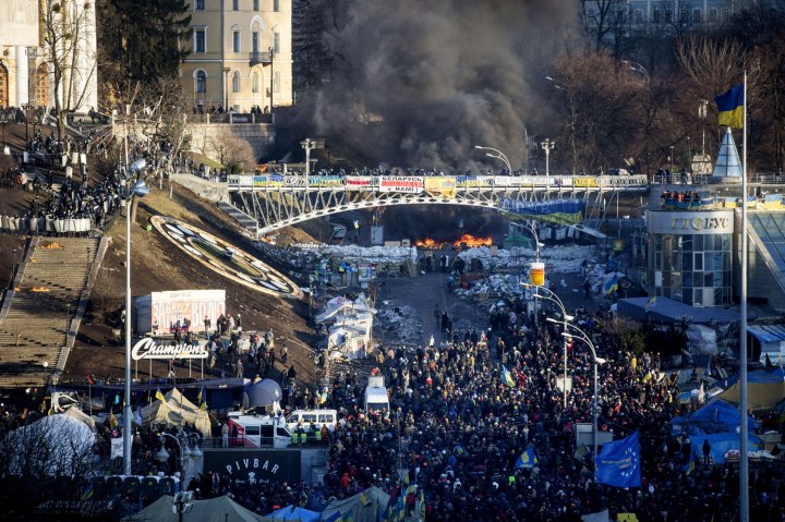 Anti-government protesters clash with riot police outside Ukraine's parliament in Kiev, on Feb. 18, 2014.