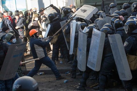 Interior Ministry members clash with anti-government protesters during a rally in Kiev, on Feb. 18, 2014.