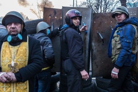 Anti-government protesters guard barricades near Independence Square on February 21, 2014 in Kiev.