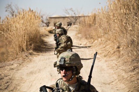 Soldiers with the U.S. Army's Bravo Company, 1st Battalion, 36th Infantry Regiment kneel while on patrol near Command Outpost AJK in Maiwand District, Kandahar Province Jan. 24, 2013.